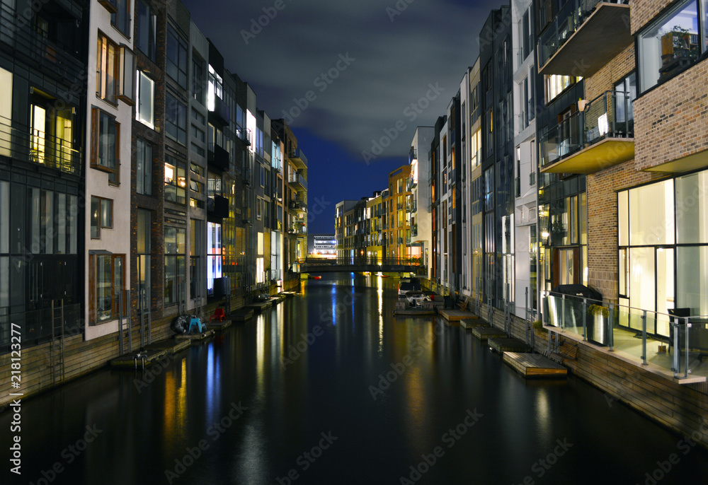 Modern housing on the canals in Copenhagen at night.