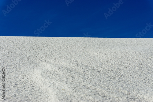 white sand blue sky