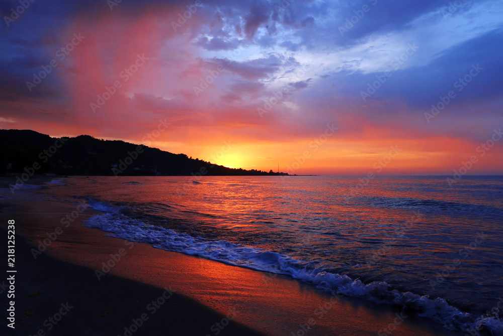 Scenic colorful sunset at the sea coast