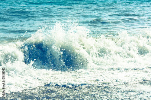 Vintage style image of waves crashing in the deep blue Mediterranean sea