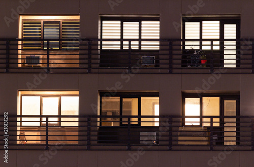 Apartment windows at night in the city.