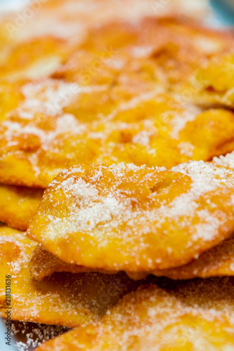 Closeup of a Pile of Sweet Fried Dough Pastries (Beavertails) and Donuts Topped with Sugar