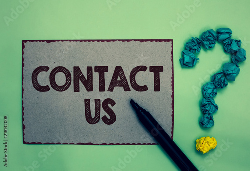 Word writing text Contact Us. Business concept for Group of person that rendering costumer service through telecom Gray paper marker crumpled papers forming question mark green background. photo