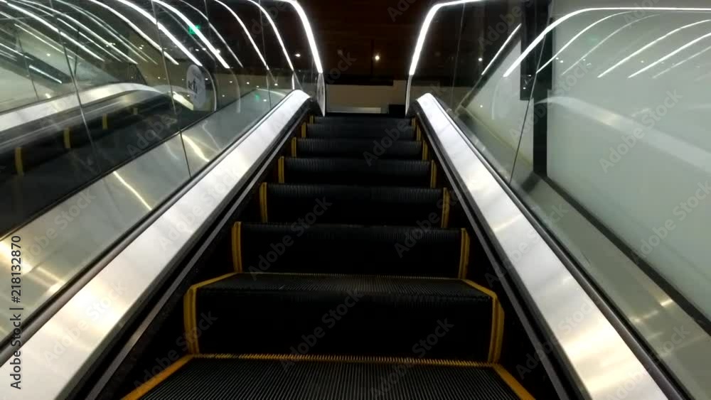 Slow motion: Escalator upward movement. Slow motion: Escalator upward movement.