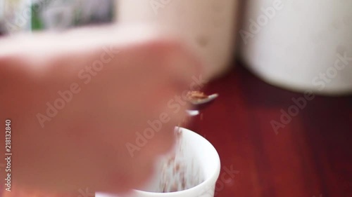 here ypu can see coffee being poured into a cup with a cozy background to make it more personal. photo