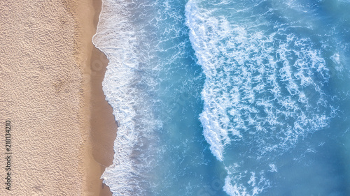 Wave on the beach as a background. Beautiful natural background at the summer time. Aerial seascape from drone at the summer time