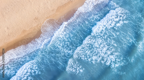 Wave on the beach as a background. Beautiful natural background at the summer time. Aerial seascape from drone at the summer time