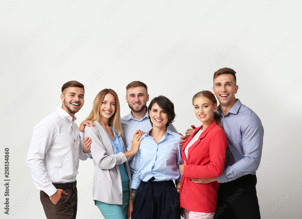 Group of young people on light background. Teamwork concept Group of young people on light background. Teamwork concept