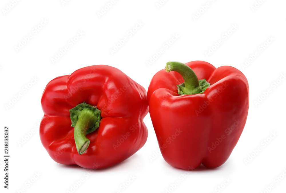 Raw ripe paprika peppers on white background Raw ripe paprika peppers on white background