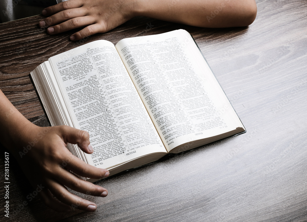 Naklejka premium Hands With Open Bible