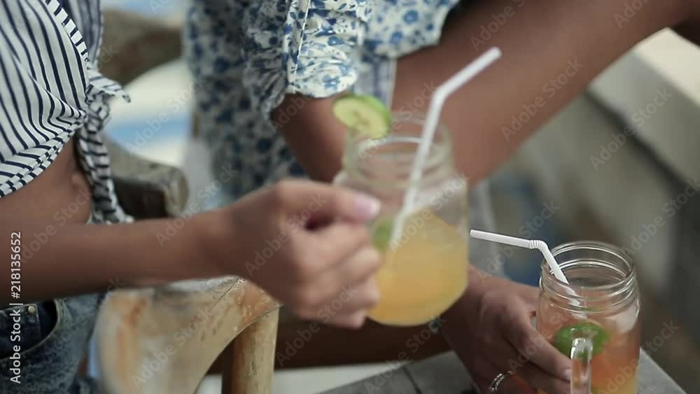 Girls relaxing with cocktails