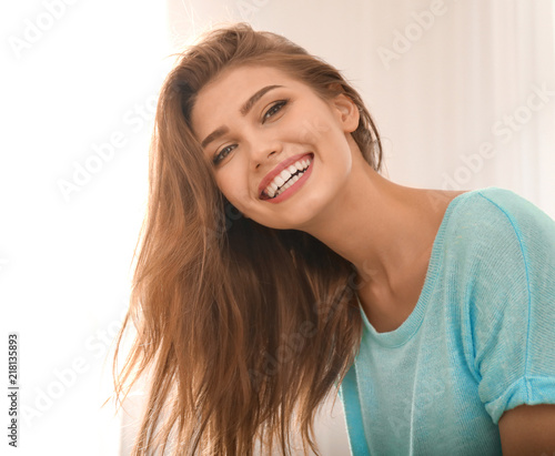 Portrait of beautiful smiling woman at home