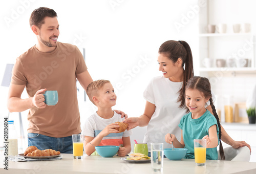 Happy family having breakfa...