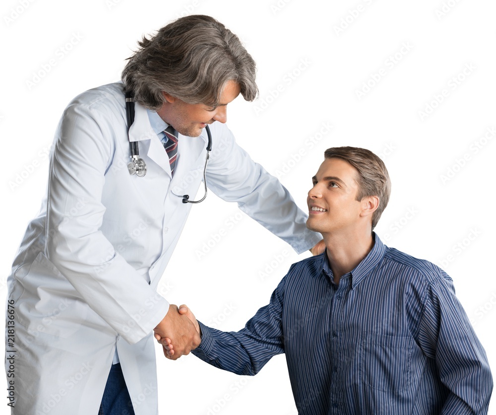 Portrait of a Mature Doctor Shaking Hands with Young Patient Portrait of a Mature Doctor Shaking Hands with Young Patient