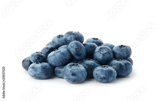 Heap of fresh ripe blueberries on white background