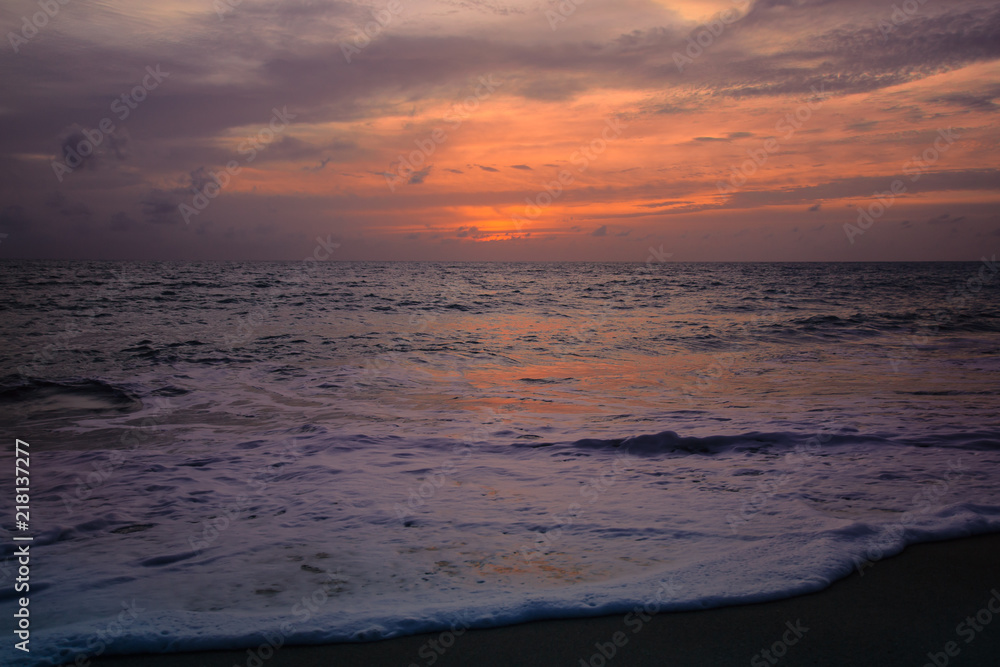 View of the sunset at Mai Khao Beach in Phuket, Thailand View of the sunset at Mai Khao Beach in Phuket, Thailand
