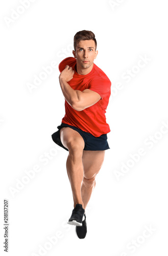 Sporty young man running on white background © New Africa