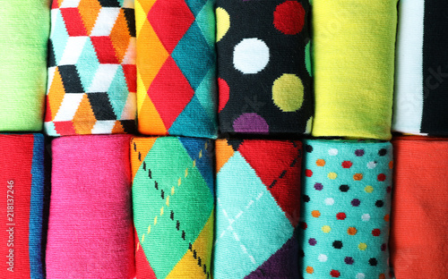 Different colorful socks as background, closeup photo