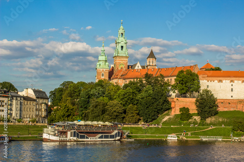 beautiful medieval european castle near river waterfront old city district and space for walking concept shot in bright colorful contrast summer day time without people on blue sky background 