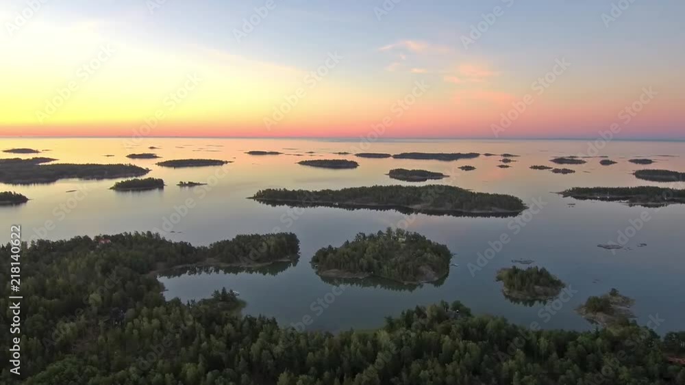 aerial: flying along the coast and turn slowly towards the rising sun aerial: flying along the coast and turn slowly towards the rising sun