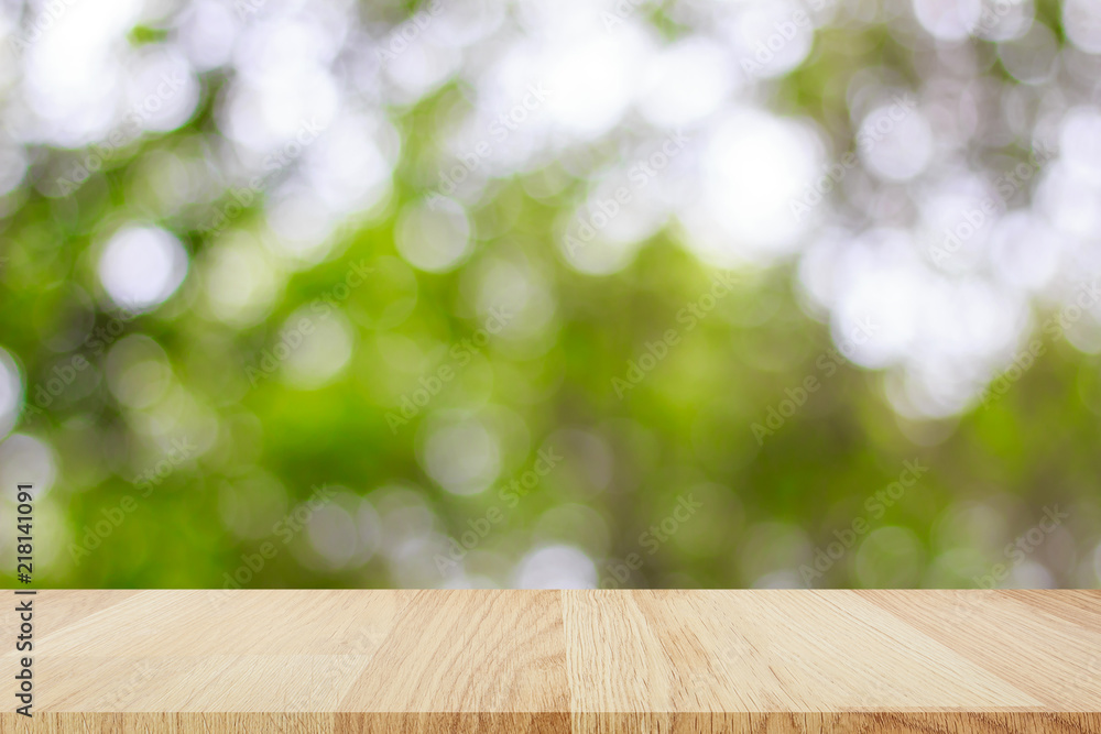 Empty wooden table with abstract bokeh light background for montage of your product Empty wooden table with abstract bokeh light background for montage of your product