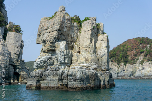 Stone pillar emerged from the sea is the part of Geoje Haegeumgang rock islands in the Hanryeo marine national Park, Geoje City, South Korea.