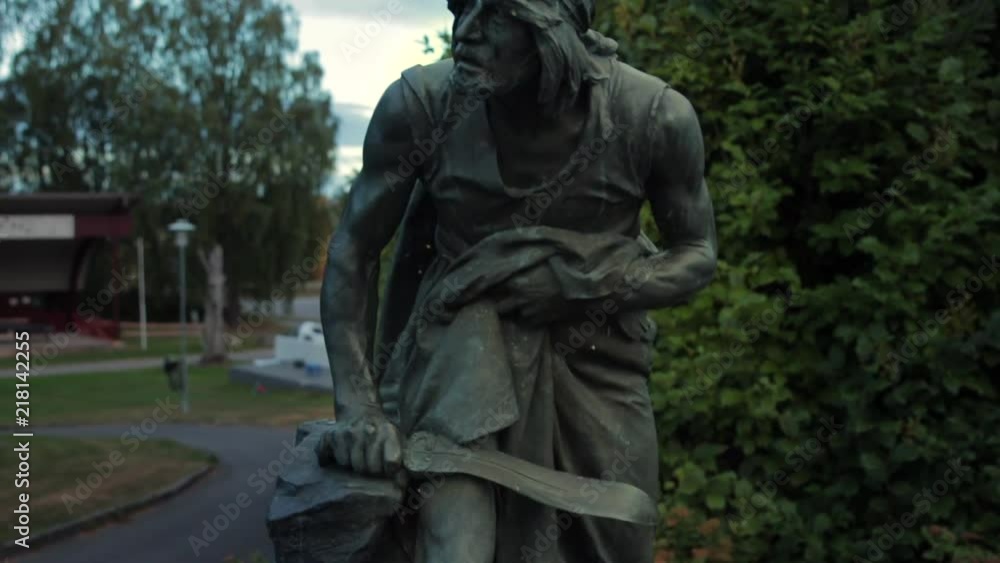 Slow pan up of a bronze statue of a Norwegian warrior in the early morning light Slowmotion Slow pan up of a bronze statue of a Norwegian warrior in the early morning light Slowmotion