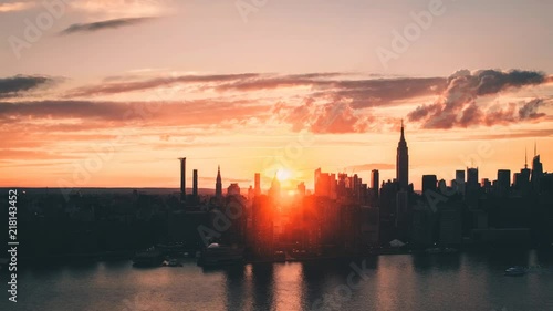 Time lapse Cinemagraph of moving clouds over New York city at sunset