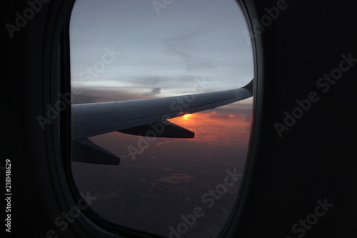 sunset view from airplane window  with wing