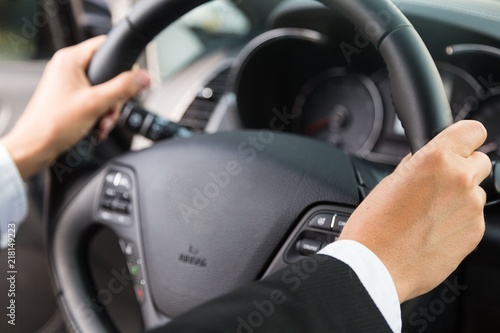 Close-up of Hands on a Steering Wheel