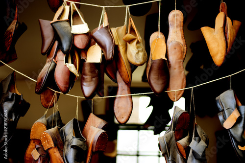 Handmade shoes hanging on display