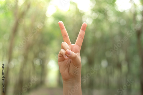 Two fingers with blur background body language sign V sign.