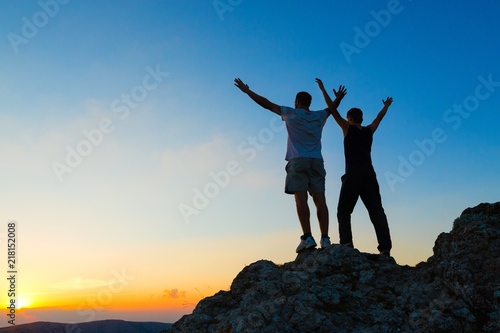 Two Men Celebrating on Mountain Top
