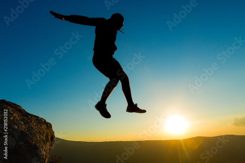 Man Jumping on Rocks