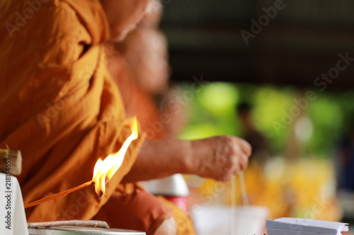 Candle light in Buddhist prayer process.