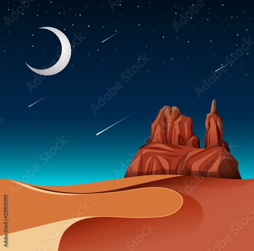 A desert landscape at night