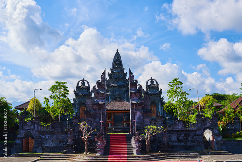 Beautiful view of ancient stone carving of temple on Bali island. Balinese hindu temple ornamented by carvings and sculptures. Old hindu architecture, ancient design. Summer and vacation concept.