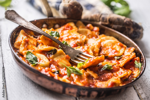 Italian or mediterranean food pasta ravioli of tomato sauce. photo