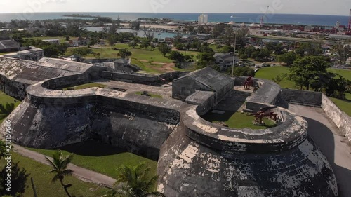 4K Cinematic Aerial Flythrough over the top of the historical Fort Charlotte in Nassau Bahamas. photo