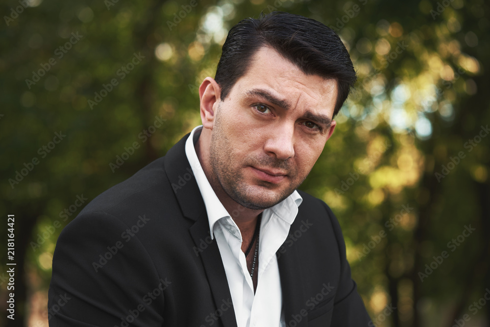 portrait of a handsome man in the park portrait of a handsome man in the park