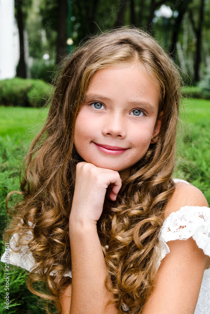 Portrait of adorable smiling little girl child outdoors Portrait of adorable smiling little girl child outdoors