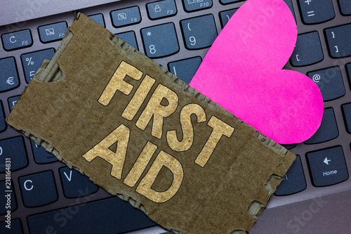 Conceptual hand writing showing First Aid. Business photo text Practise of healing small cuts that no need for medical training Paperboard Romantic lovely message Heart Keyboard Type computer. photo