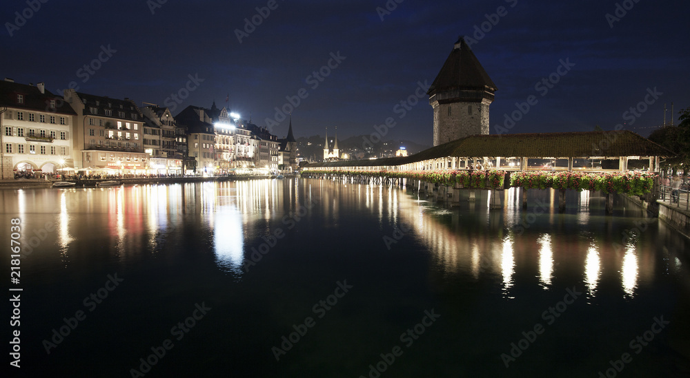 Night view of wooden Chapel Bridge and Lucerne old town, Switzerland