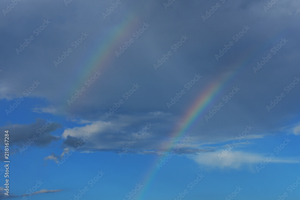 Beautiful double rainbow over the sky 