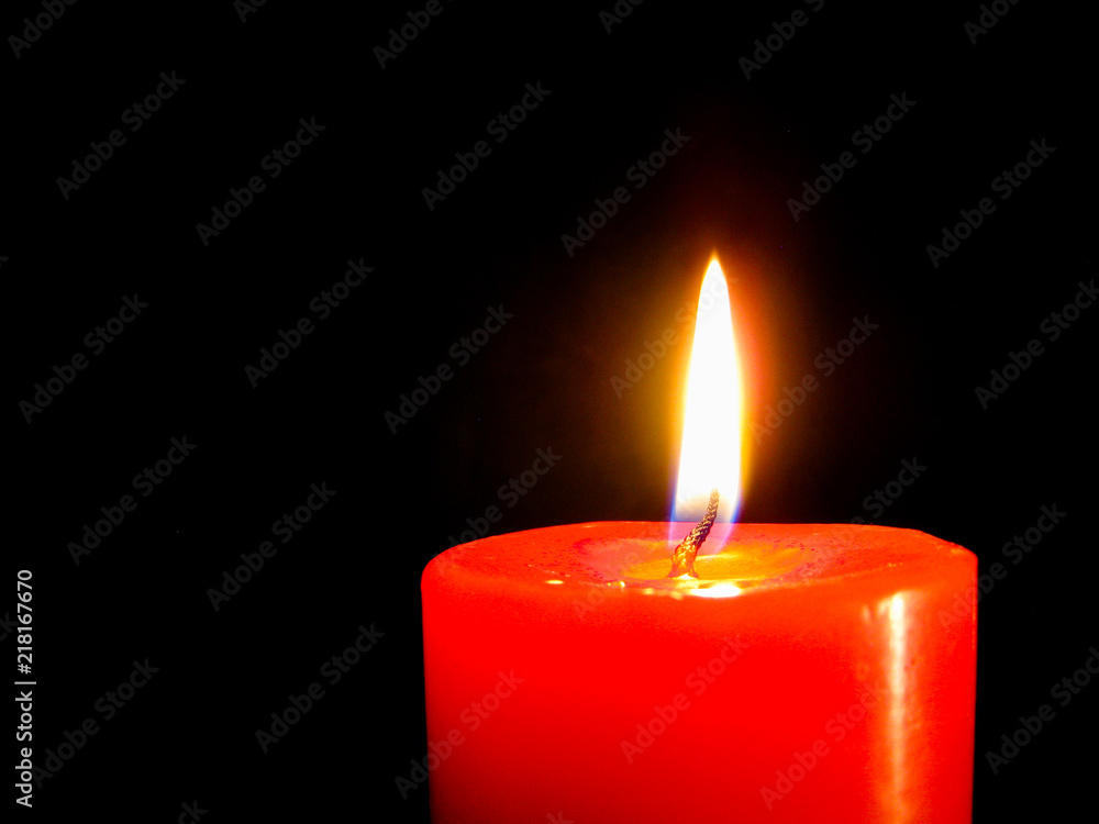 candle flame in dark background. candle flame in dark background.