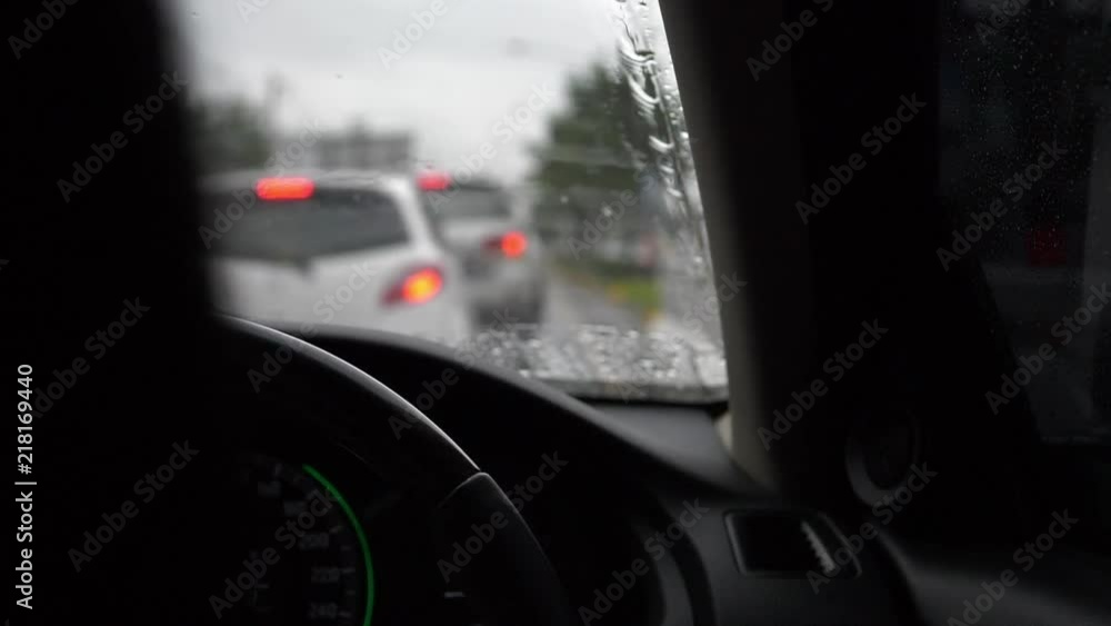 traffic jam in rainy day, slow motion windshield wiper swing clearing water rain traffic jam in rainy day, slow motion windshield wiper swing clearing water rain