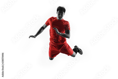 Professional football soccer player in motion isolated on white studio background