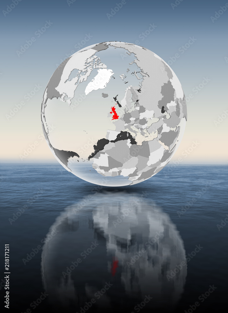 United Kingdom on translucent globe above water United Kingdom on translucent globe above water