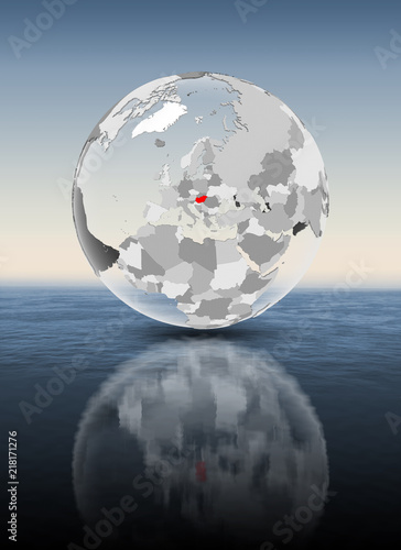 Hungary on translucent globe above water