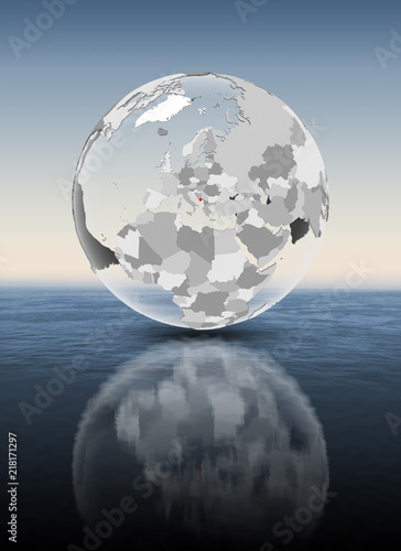 Montenegro on translucent globe above water